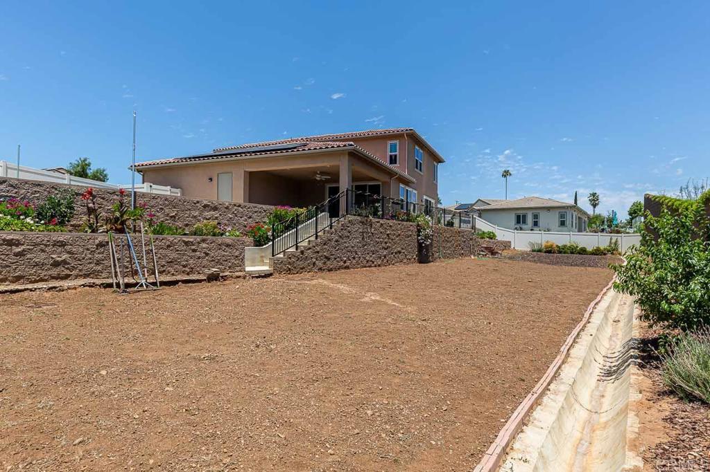 1281 Palomar Circle Escondido, CA 92027 - Photo 28 of 31 a front view of a house with a yard