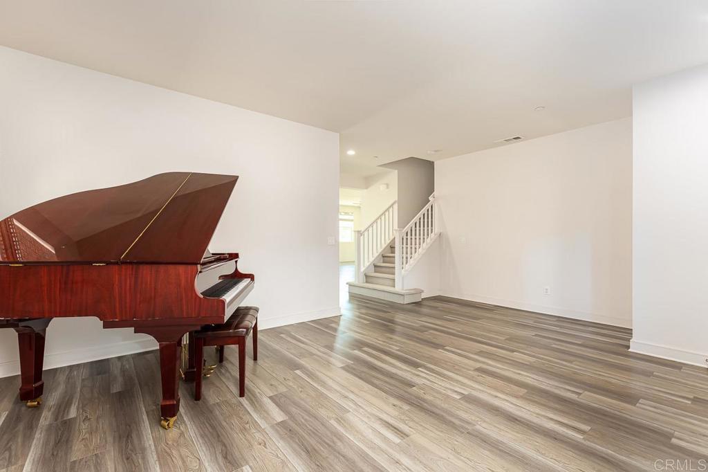 1281 Palomar Circle Escondido, CA 92027 - Photo 10 of 31 a view of a livingroom with wooden floor and an chairs