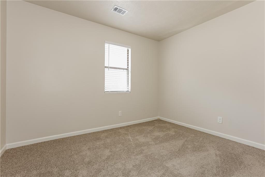3352 Herrenhut Road Lithonia, GA 30038 - Photo 17 of 27 an empty room with a window