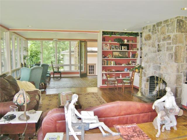 3217 Sherwood Road Sewanee, TN 37375 - Photo 7 of 20 Stone fireplace for crisp fall evenings. Built in bookshelves and recessed lighting.