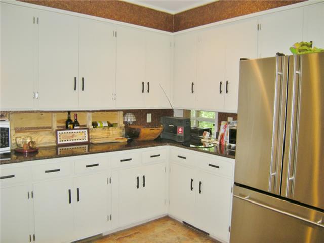 3217 Sherwood Road Sewanee, TN 37375 - Photo 9 of 20 Kitchen has granite counter tops and tile backsplash.
