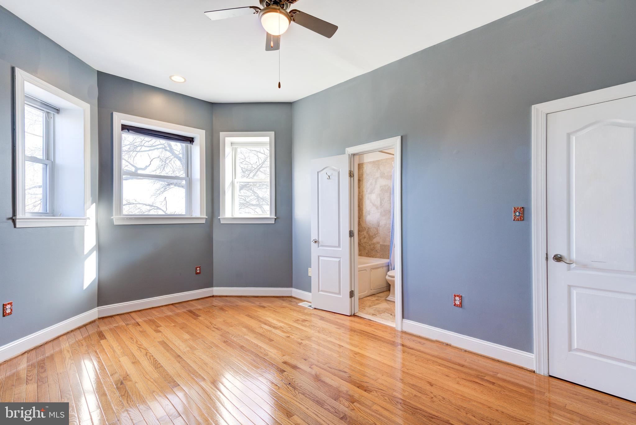 50 Rhode Island Avenue Northeast, Unit 2 Washington, DC 20002 - Photo 12 of 31 a view of an empty room with window and wooden floor