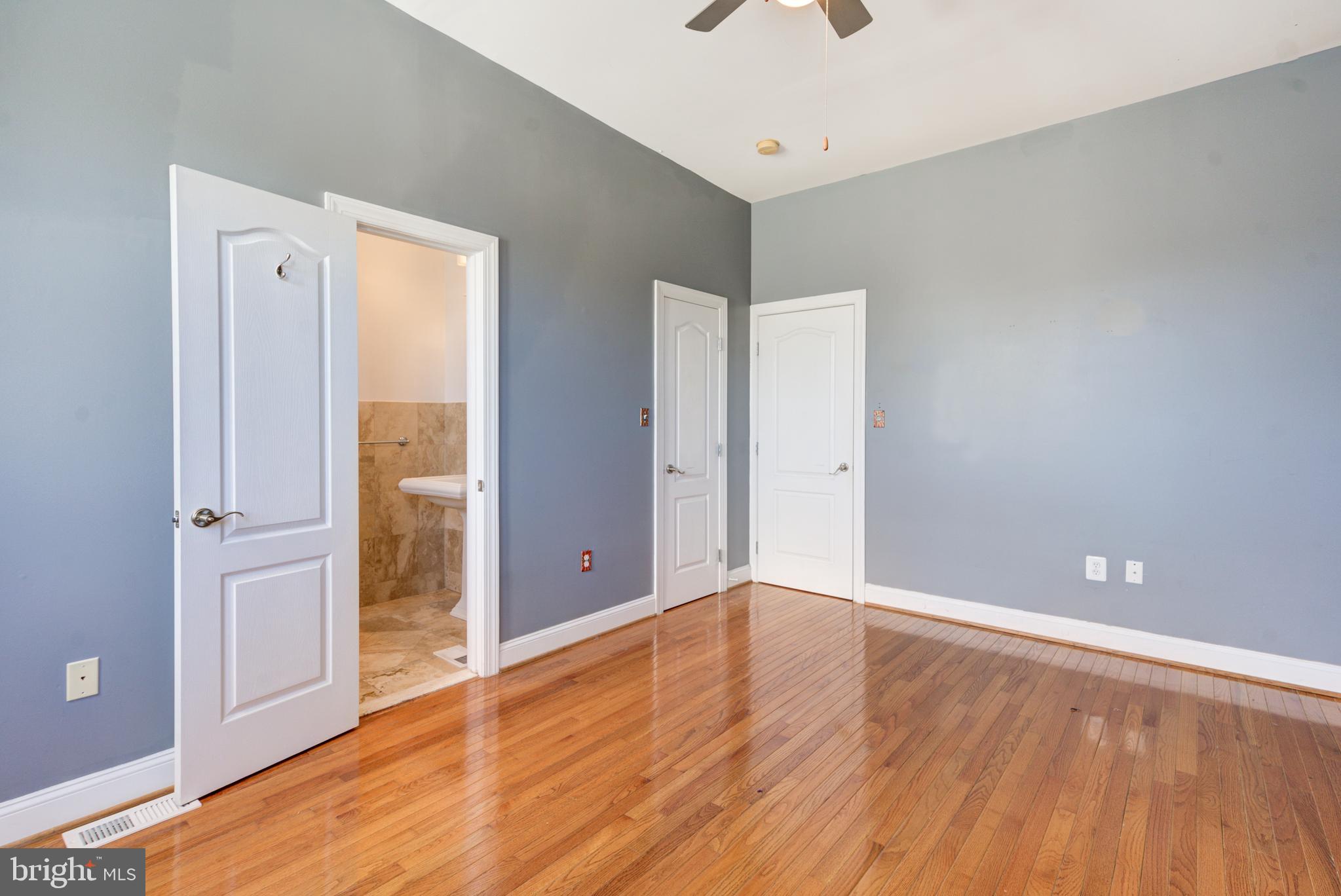 50 Rhode Island Avenue Northeast, Unit 2 Washington, DC 20002 - Photo 13 of 31 wooden floor in an empty room with a window