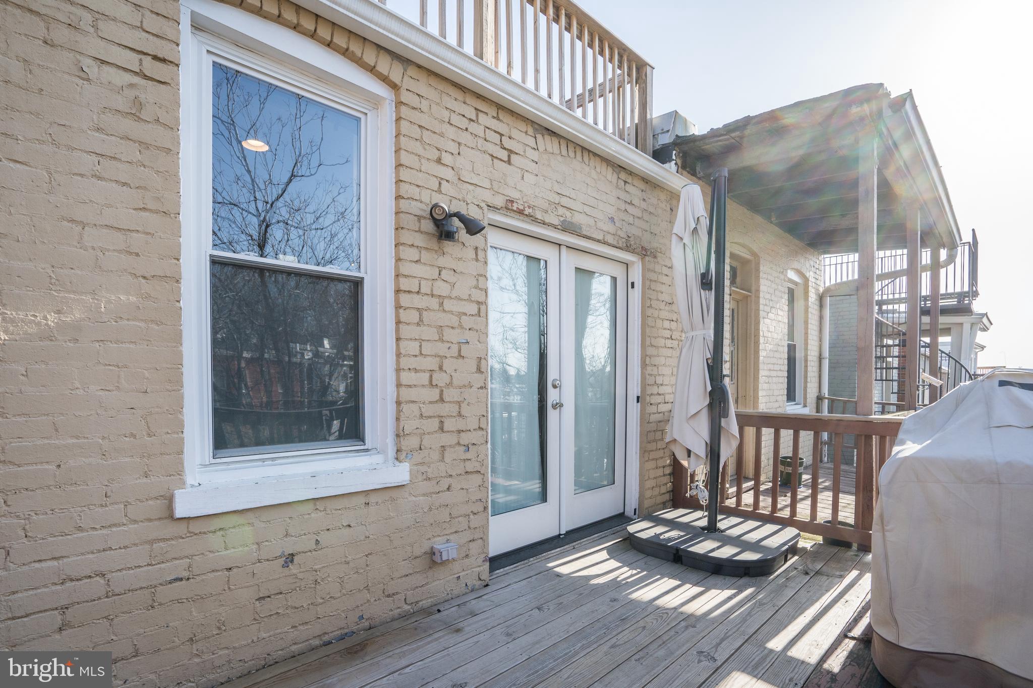 50 Rhode Island Avenue Northeast, Unit 2 Washington, DC 20002 - Photo 24 of 31 a view of a porch with wooden floor