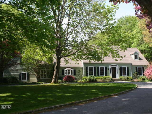 59 Main Street Ridgefield, CT 06877 - Photo 1 of 1 a front view of a house with a garden