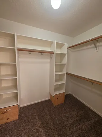 a view of an empty walk in closet