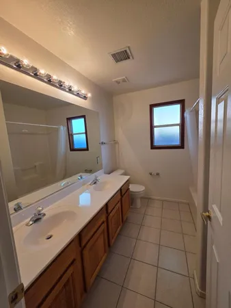 a bathroom with a sink a mirror and a bathtub
