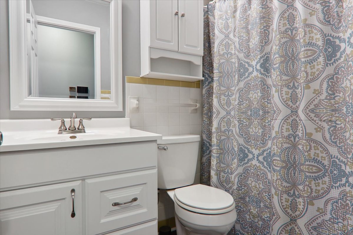 720 Lara Road Normal, IL 61761 - Photo 18 of 30 a bathroom with a sink toilet and vanity