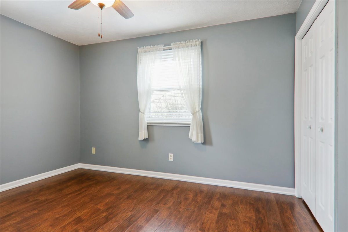720 Lara Road Normal, IL 61761 - Photo 20 of 30 an empty room with wooden floor and windows