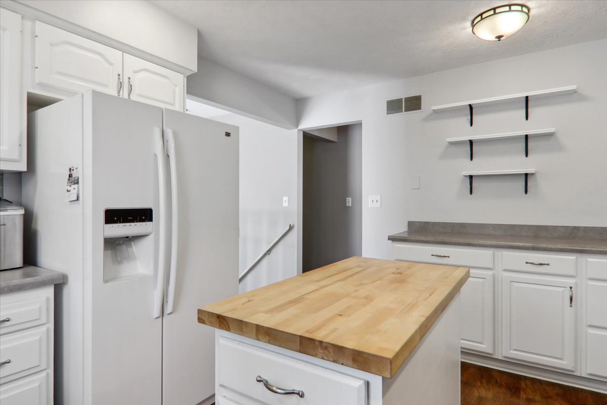 720 Lara Road Normal, IL 61761 - Photo 10 of 30 a kitchen with a stove and a refrigerator