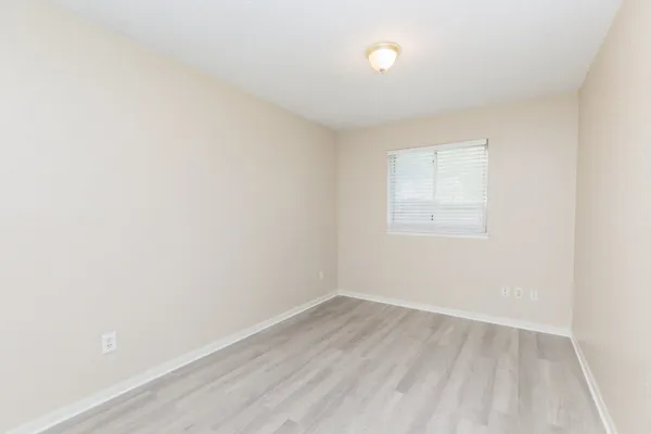 an empty room with a empty space and window