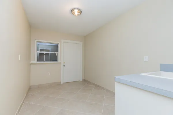a view of storage and utility room with closet