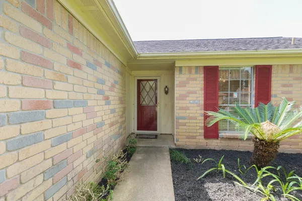 a house with garden in front of it