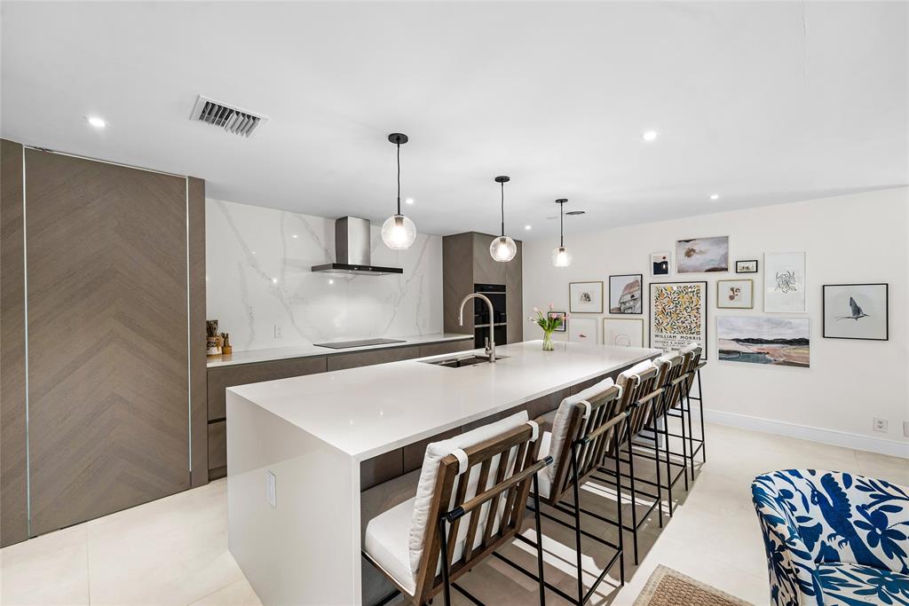 2233 Northeast 30th Court Lighthouse Point, FL 33064 - Photo 12 of 48 Swing door on the left opens to the butler's pantry and laundry room