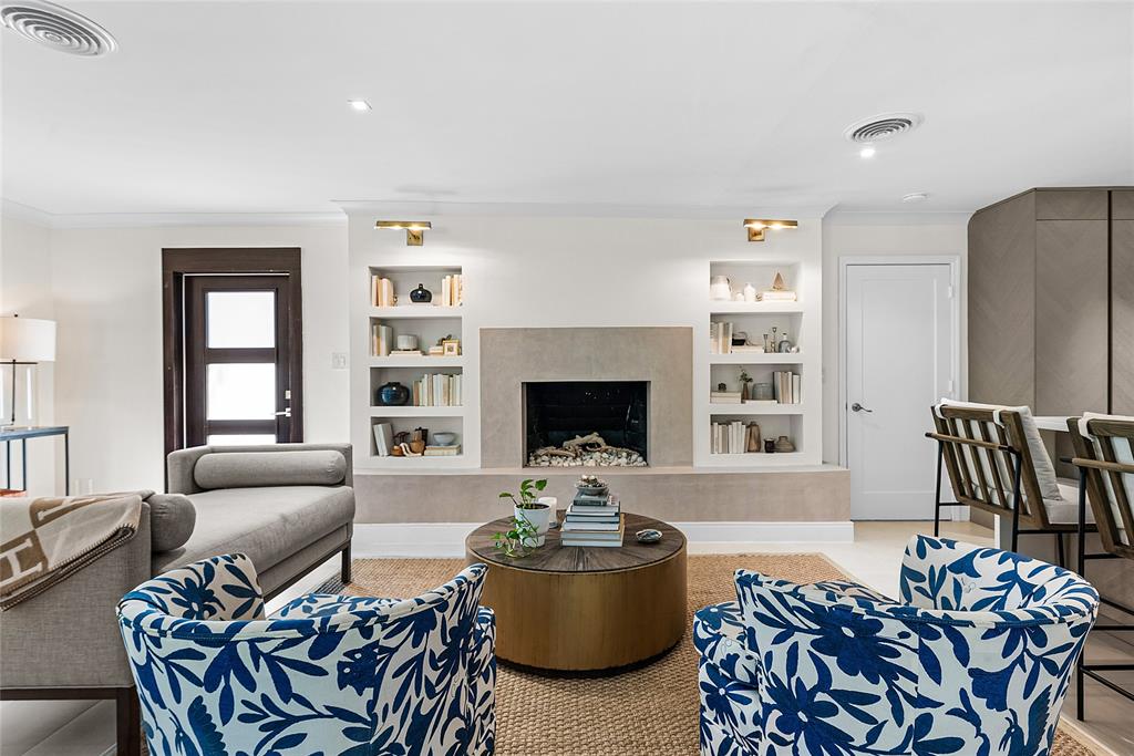 2233 Northeast 30th Court Lighthouse Point, FL 33064 - Photo 10 of 48 Wood burning fireplace surrounded by custom Microcrete wall