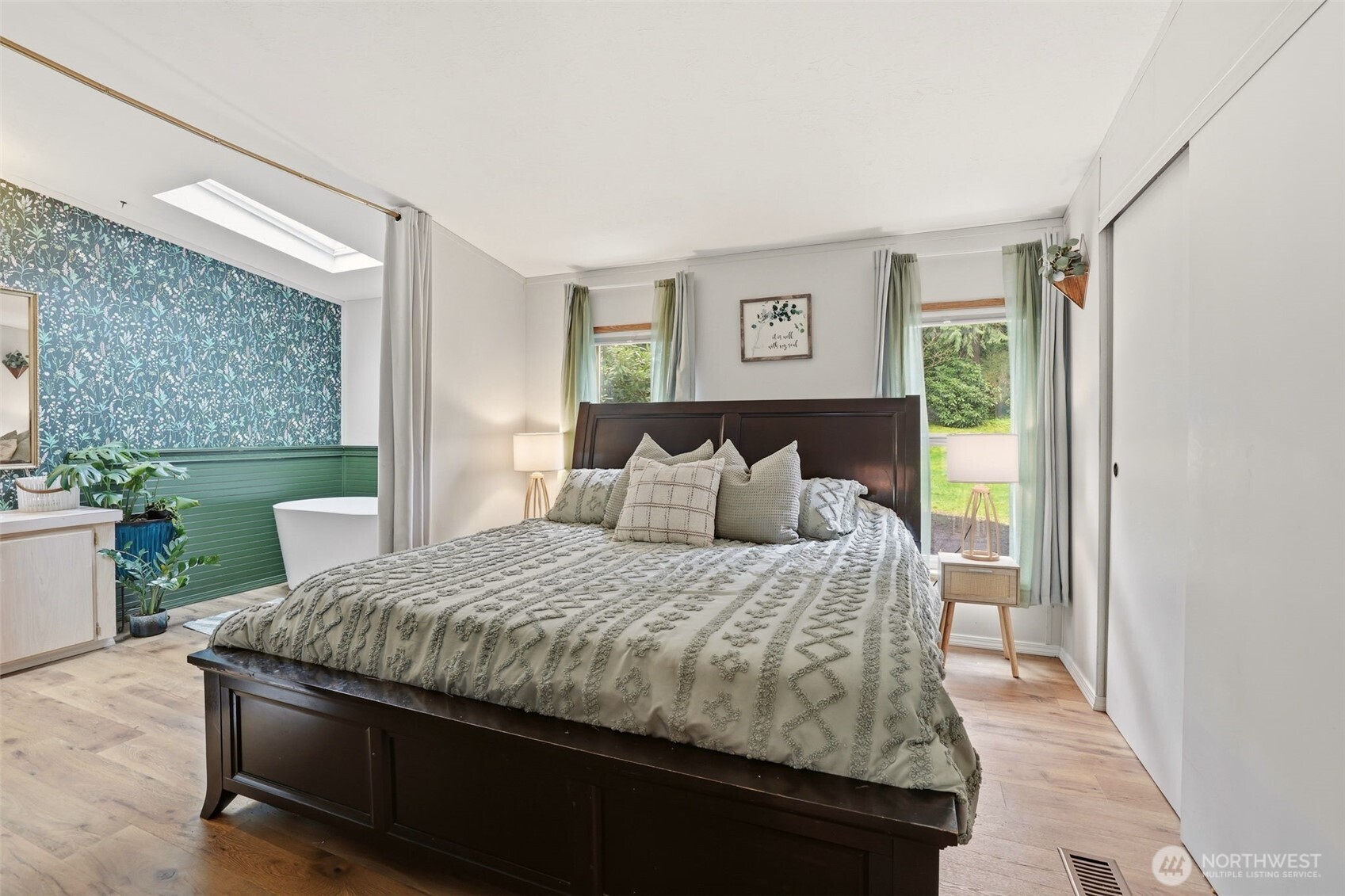 33501 112th Street Southeast Sultan, WA 98294 - Photo 14 of 31 a large bed sitting in a bedroom next to a window