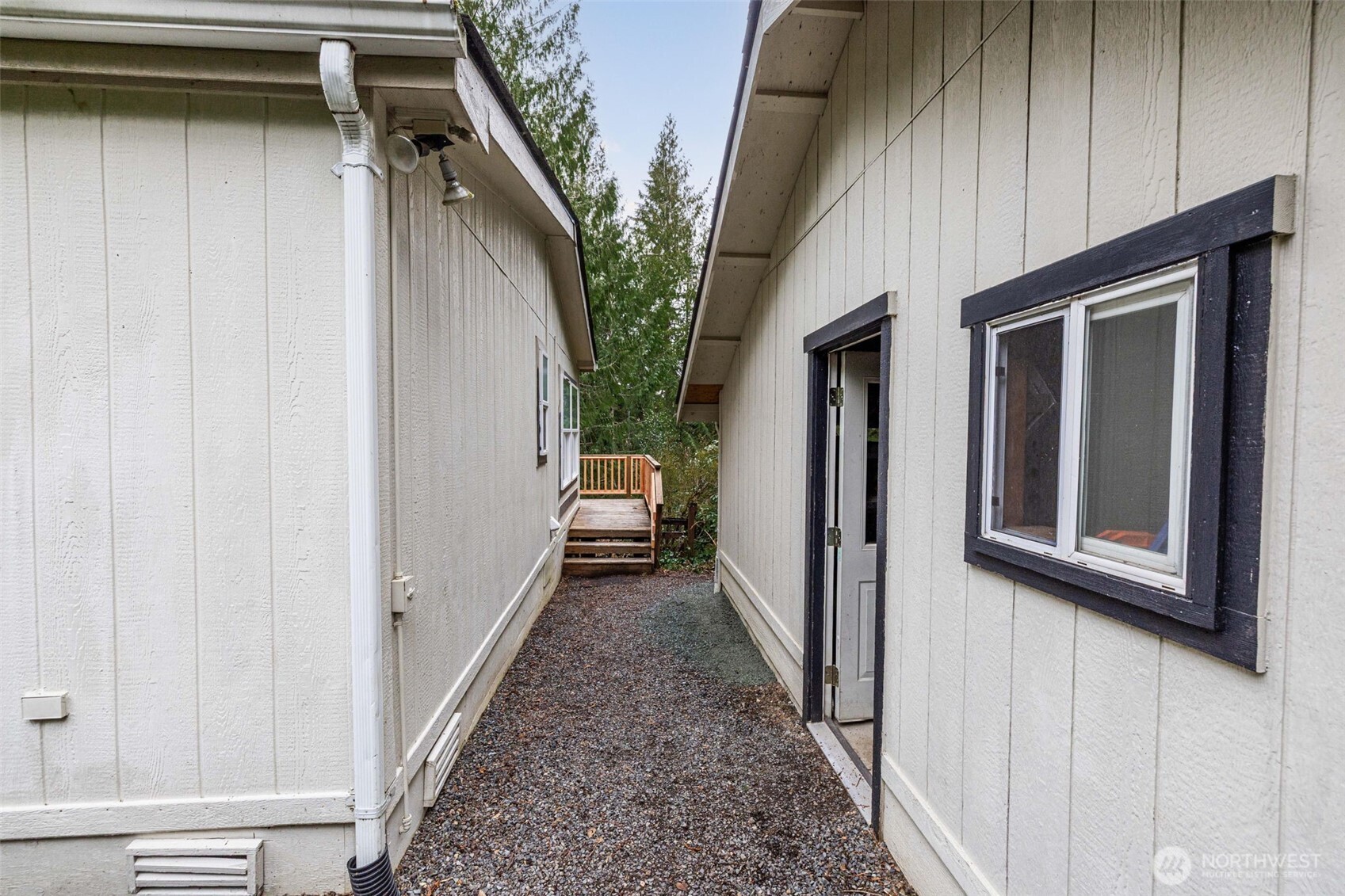 33501 112th Street Southeast Sultan, WA 98294 - Photo 22 of 31 a view of a pathway of a house with wooden walls and stairs