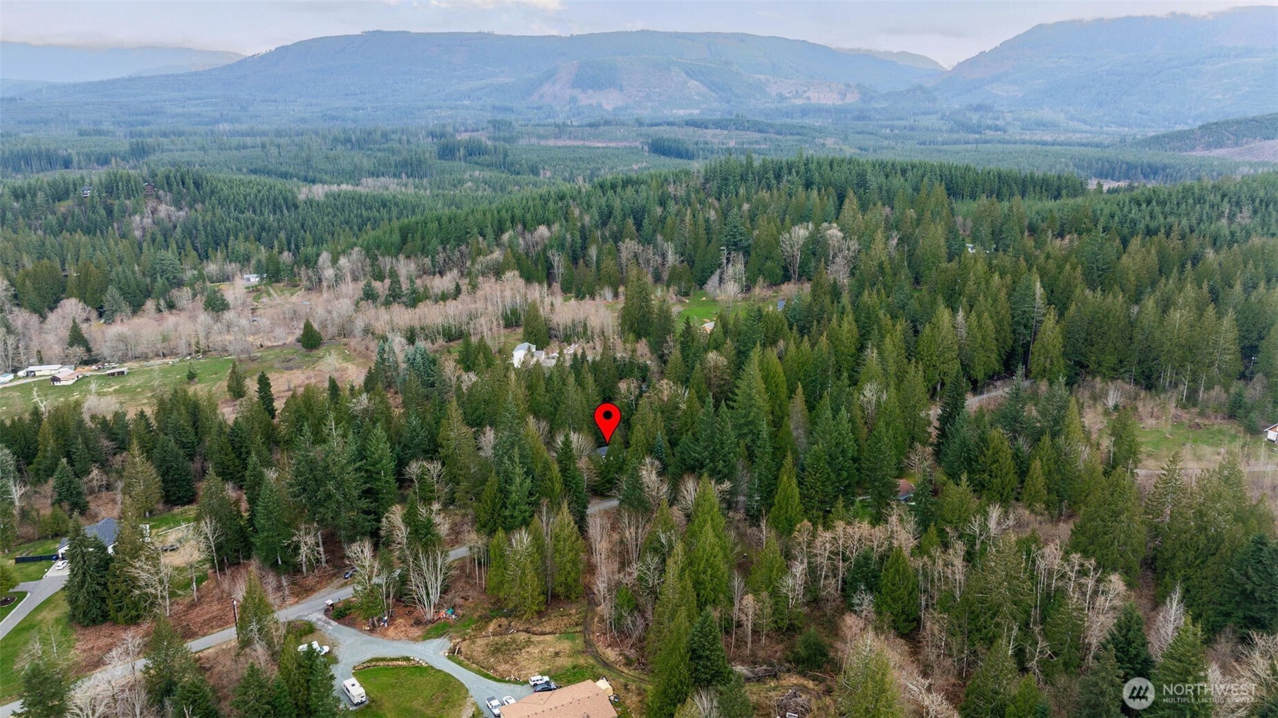 33501 112th Street Southeast Sultan, WA 98294 - Photo 30 of 31 a view of a lush green hillside and a building