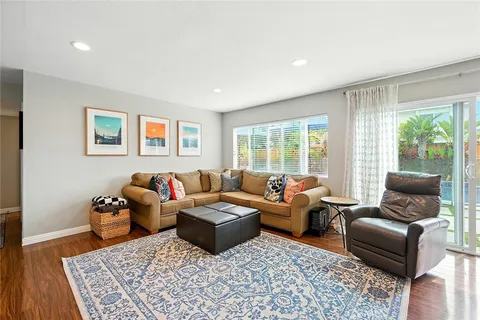 a living room with furniture and a rug