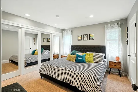 a bedroom with a large bed and a view of bedroom