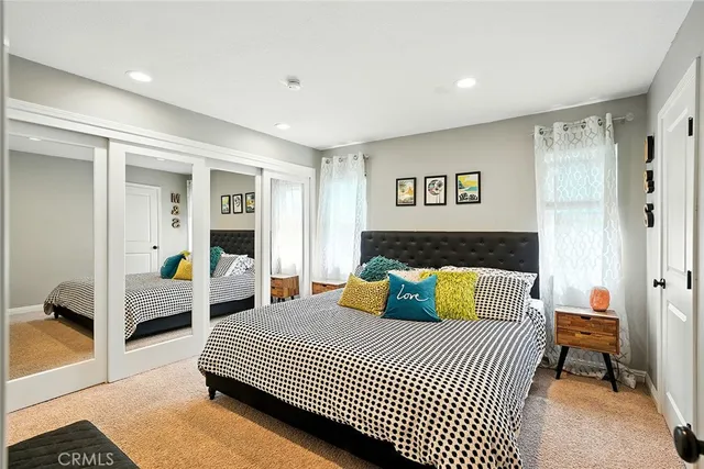 a bedroom with a large bed and a view of bedroom