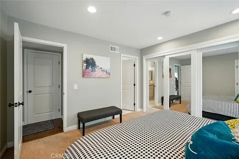 a bedroom with a bed and a walk in closet