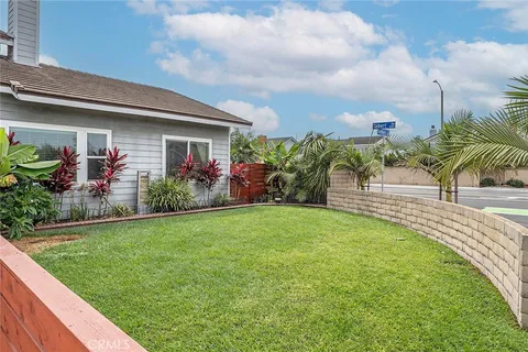 a front view of house with yard and outdoor seating