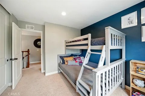 a view of a livingroom with furniture and staircase