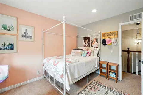 a bedroom with a bed and a table