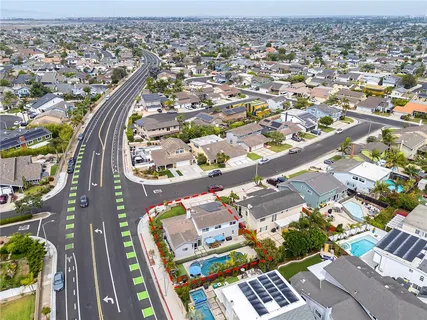 an aerial view of residential houses with outdoor space