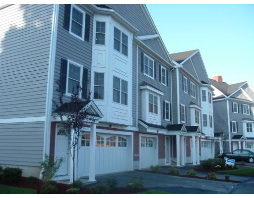 1975 Middlesex Street, Unit 7 Lowell, MA 01851 - Photo 1 of 6 a front view of a building with balcony