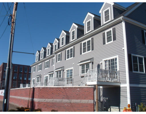 1975 Middlesex Street, Unit 7 Lowell, MA 01851 - Photo 6 of 6 a front view of a building with street