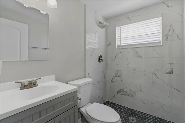 a bathroom with a window and shower