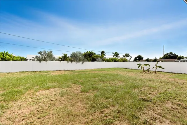 a view of a yard with an ocean view