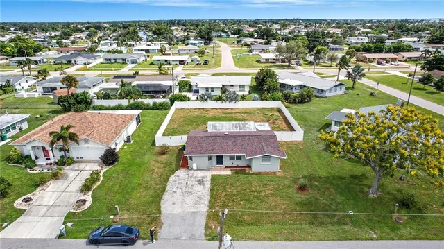 an aerial view of residential houses with outdoor space