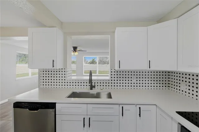 a kitchen with a sink and a microwave