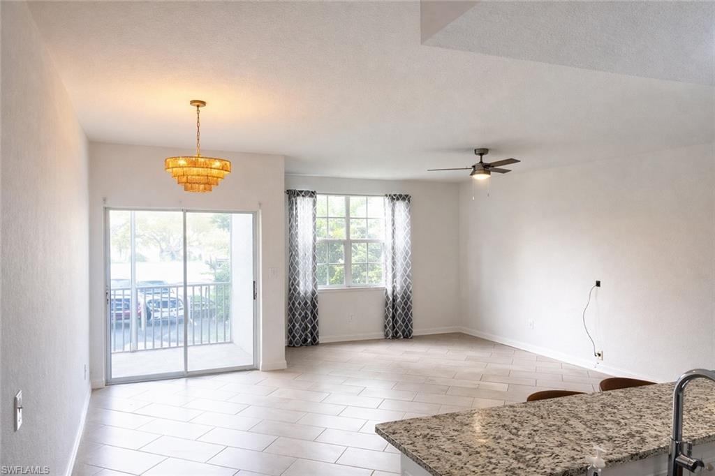 4635 St Croix Lane, Unit 1222 Naples, FL 34109 - Photo 6 of 20 a view of an empty room with a window