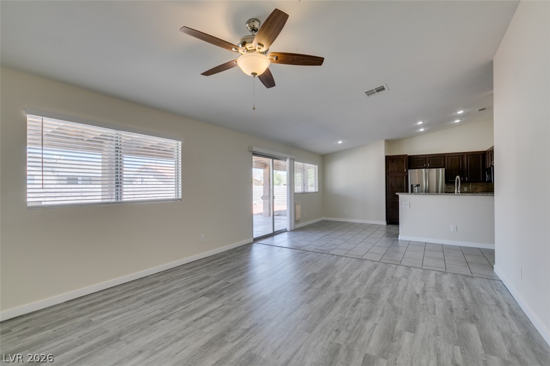 2028 Rustler Ridge Avenue North Las Vegas, NV 89031 - Photo 11 of 40 An inviting open concept living area boasts a modern kitchen and sleek flooring.