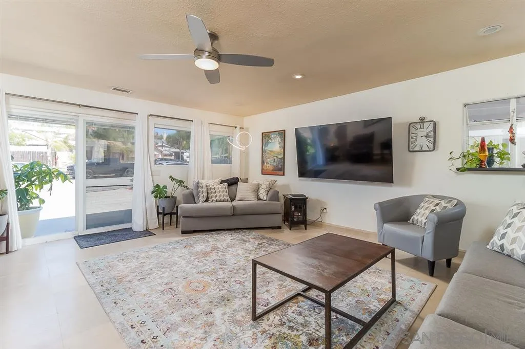 9215 Dalehurst Road Santee, CA 92071 - Photo 4 of 25 a living room with furniture and a flat screen tv