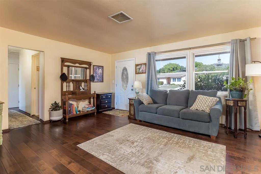 9215 Dalehurst Road Santee, CA 92071 - Photo 6 of 25 a living room with furniture and a large window