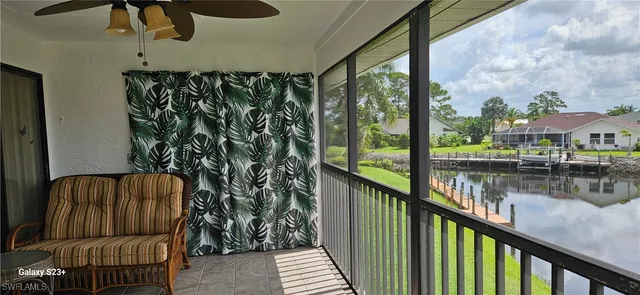 a view of a balcony with furniture