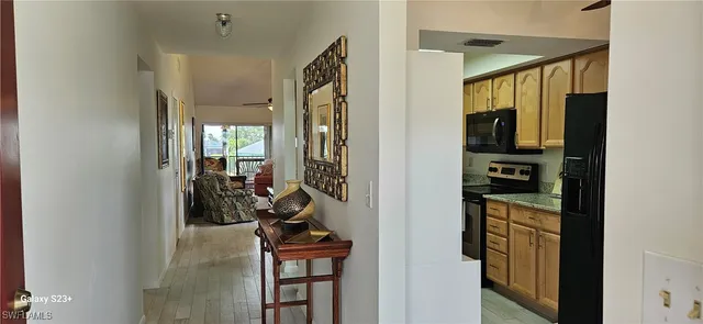 a kitchen with stainless steel appliances a refrigerator and a stove