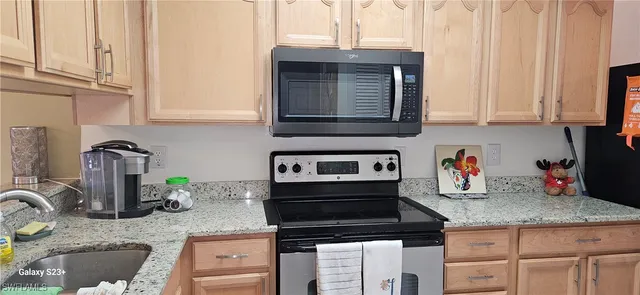 a dining room with furniture and chandelier