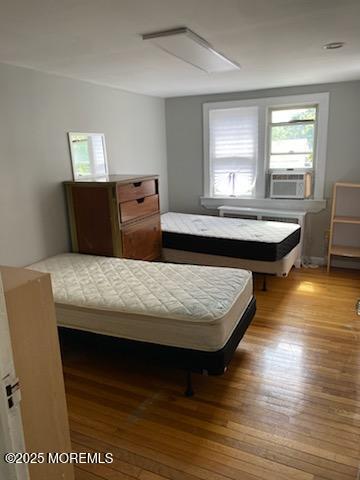 649 Hoey Avenue Long Branch, NJ 07740 - Photo 8 of 13 a living room with a table chairs and wooden floor