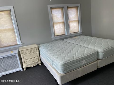 649 Hoey Avenue Long Branch, NJ 07740 - Photo 10 of 13 a bed sitting in a bedroom next to a window