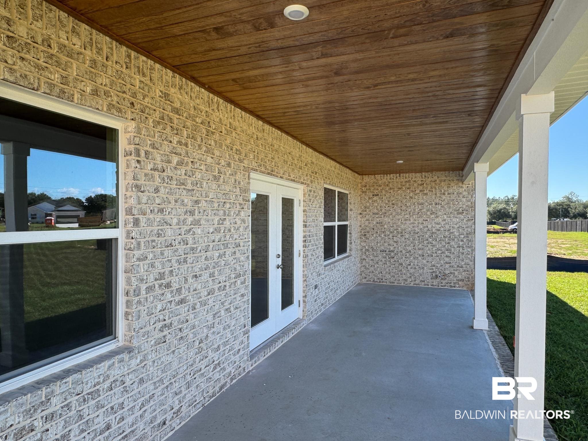 24026 Shadowridge Drive Daphne, AL 36526 - Photo 11 of 11 View of patio featuring french doors