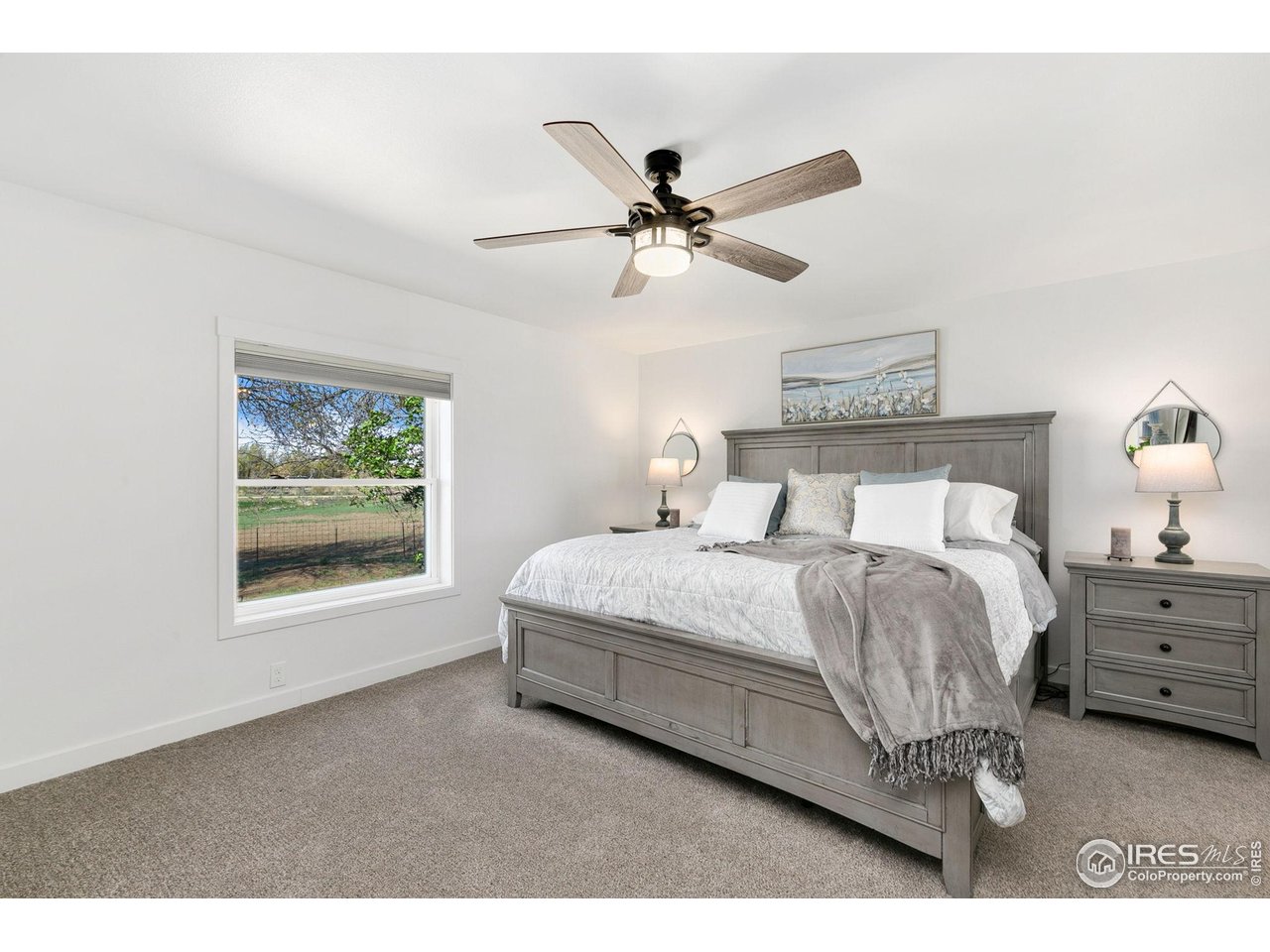 10056 County Road 76 1/2 Windsor, CO 80550 - Photo 18 of 40 Large Master Bedroom w/ walk in closet