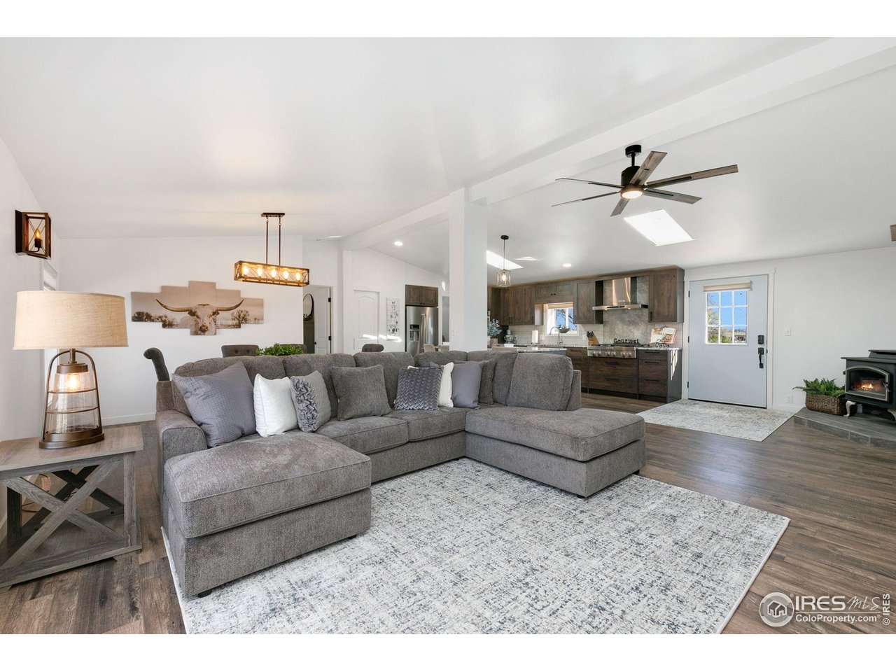 10056 County Road 76 1/2 Windsor, CO 80550 - Photo 40 of 40 Open Floor Plan- Engineered Wood Floors Custom Knotty Alder Kitchen Cabinetry