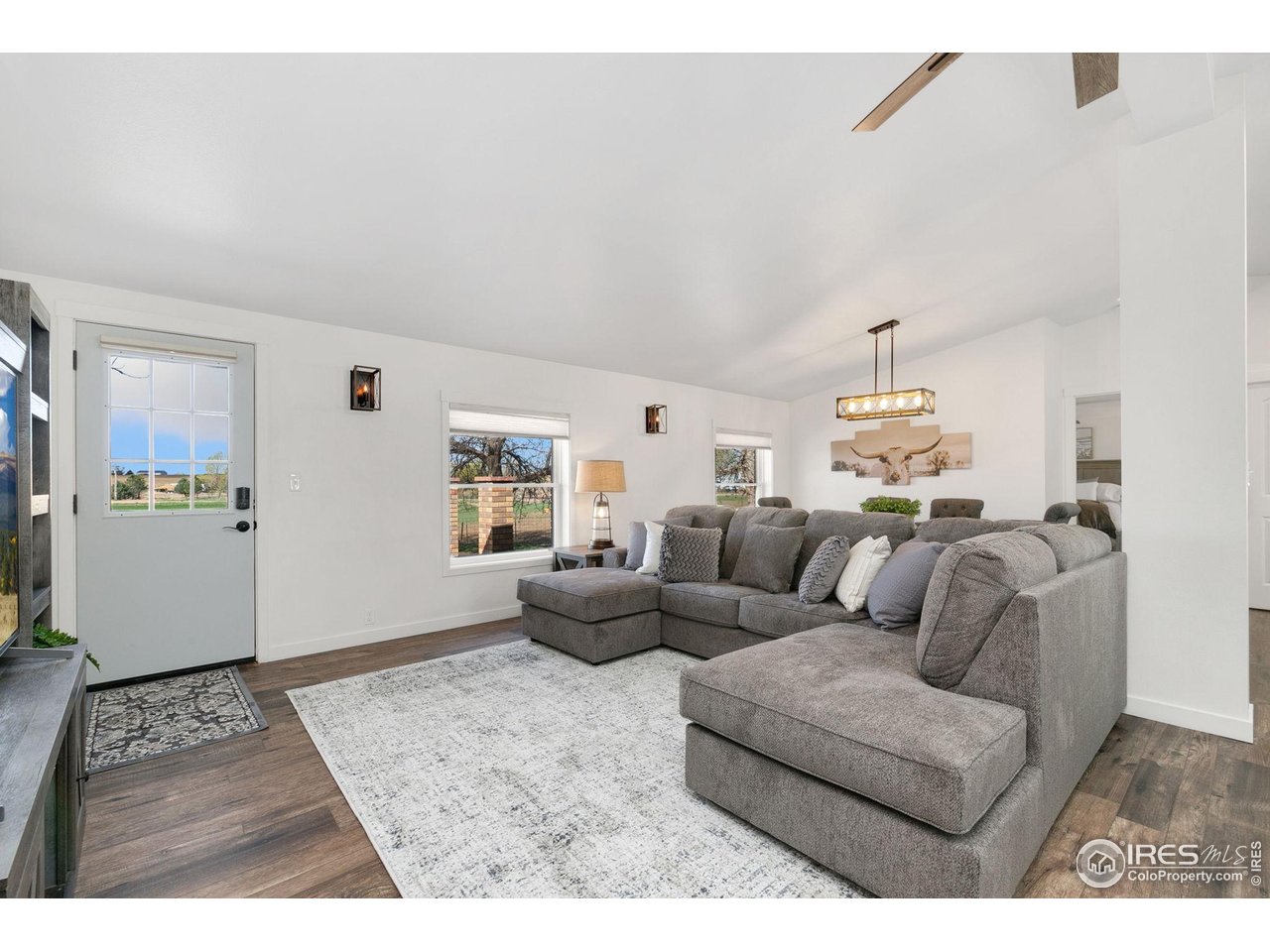 10056 County Road 76 1/2 Windsor, CO 80550 - Photo 9 of 40 Large Living Room
