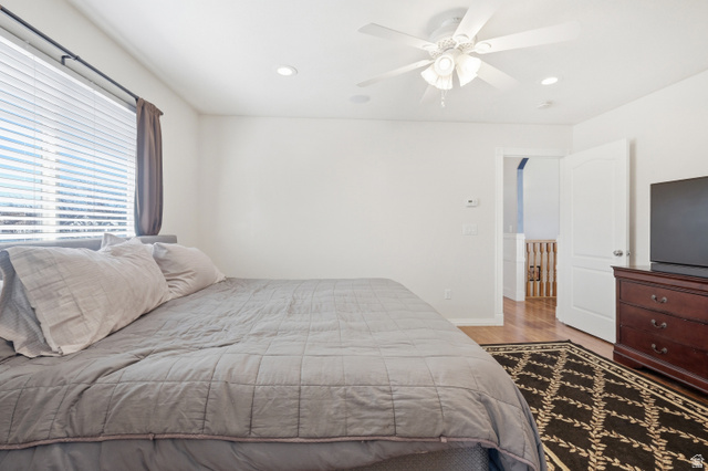 860 West 2980th Street South Logan, UT 84321 - Photo 17 of 38 Bedroom featuring a large window with blinds and drapes, recessed lighting, and a ceiling fan